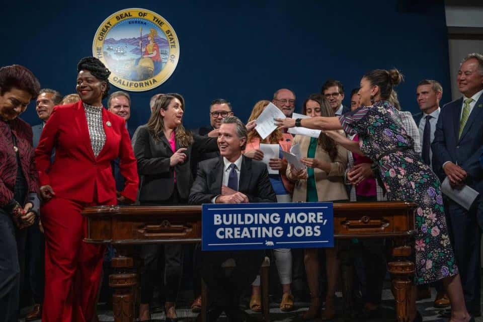 Governor Gavin Newsom Unites Lawmakers for Infrastructure Bill Signing Amidst Budget Disagreements