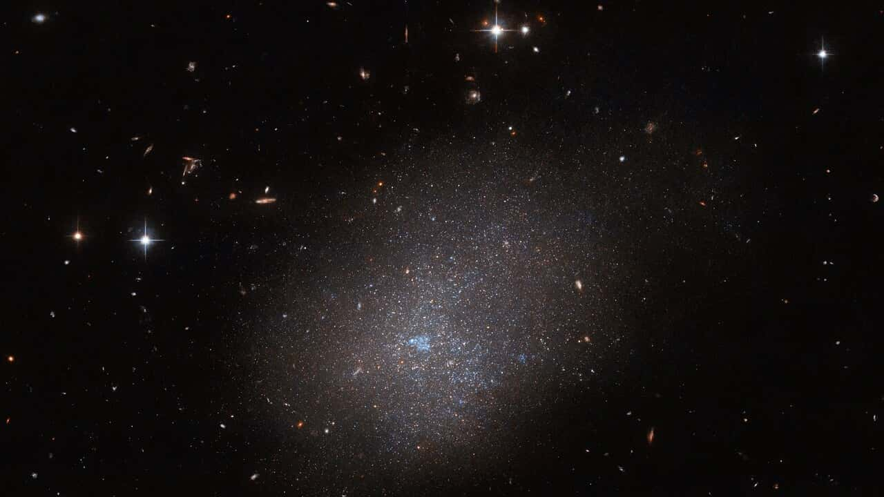 NASA Hubble Space Telescope Photographs The Ghostly Luminescence Of Distant Galaxy