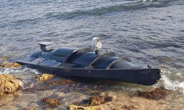 Following a Ukrainian sea drone strike on a key facility, a Russian vessel is observed drowning in the Black Sea