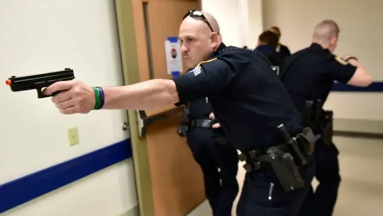 A Man With A Gun Is Arrested By Officers In Iowa City Elementary School