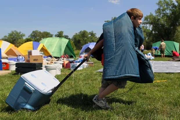 Families of migrants feel helpless at Floyd Bennett Field Tent Shelter as strong winds and rainfall cause damage