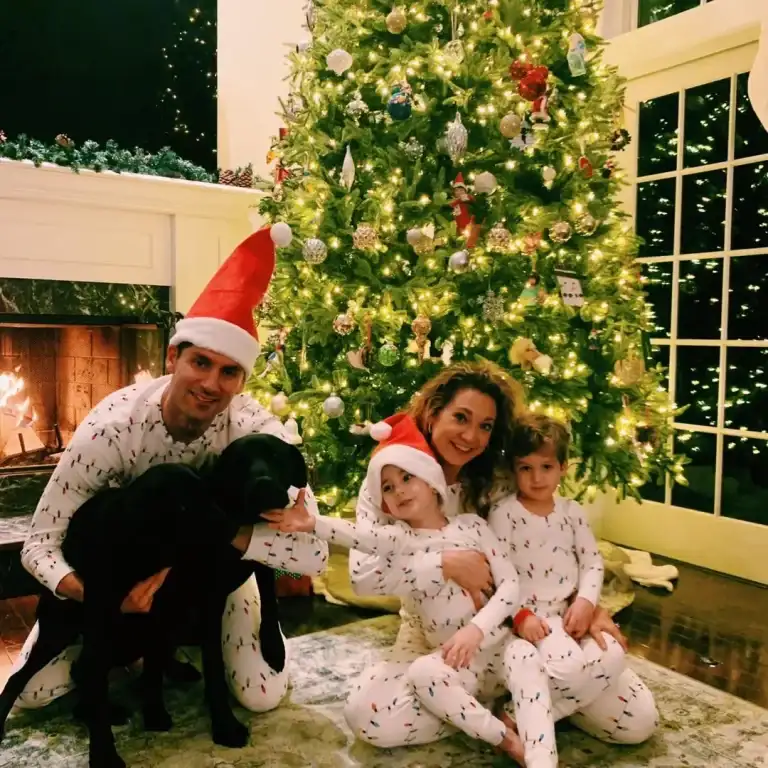 Ginger Zee of ABC presents a gorgeous Christmas tree inside a home with her husband and 2 sons