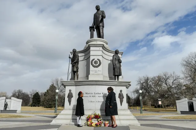 Suspect charged with damaging Denver’s MLK Jr. monument surrenders, while the hunt for the second suspect continues